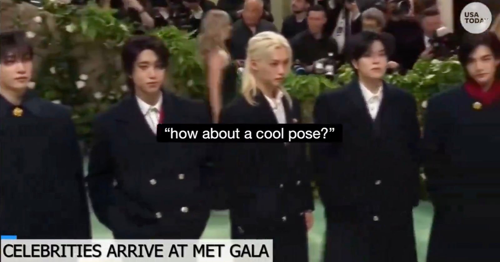 Five individuals standing side by side in formal attire at the met gala event, with a caption how about a cool pose? overlaying the image.